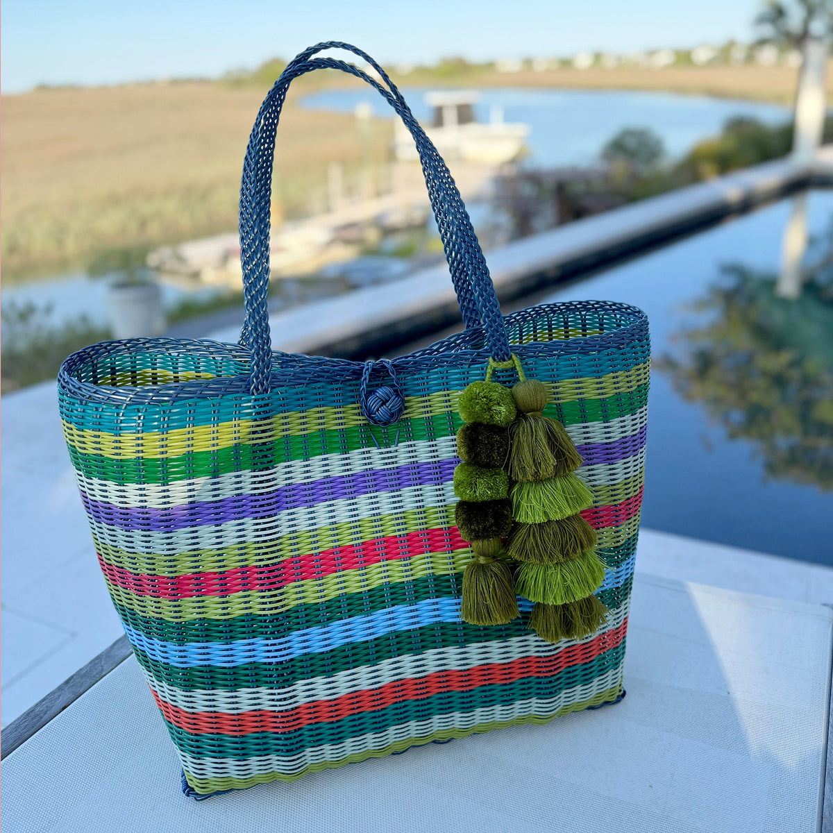 Lilley Line colorful hand-woven tote with tassels on a table by inner costal waterway