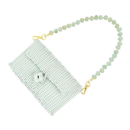 Light blue woven pouch with a beaded strap on a white background
