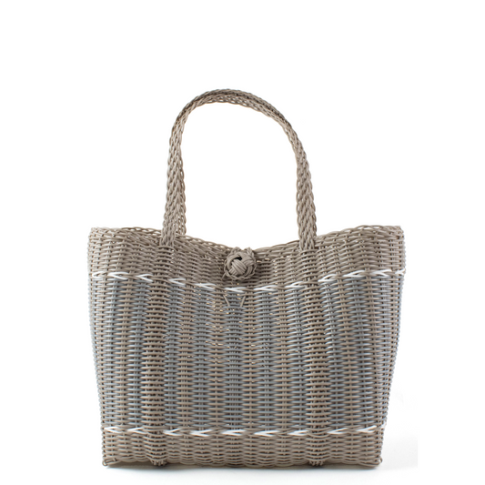 Woven handbag with a handle on a white background